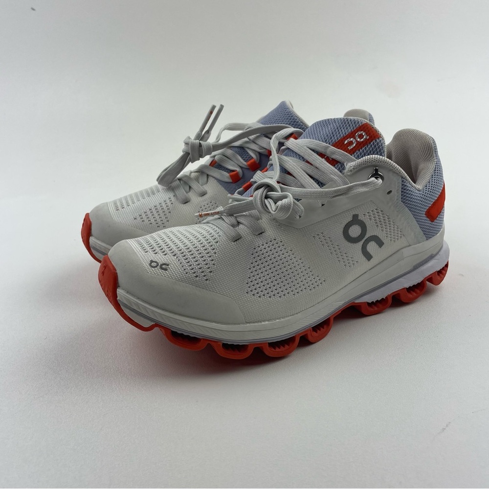 On Running Athletic Shoes in Gray and Orange.